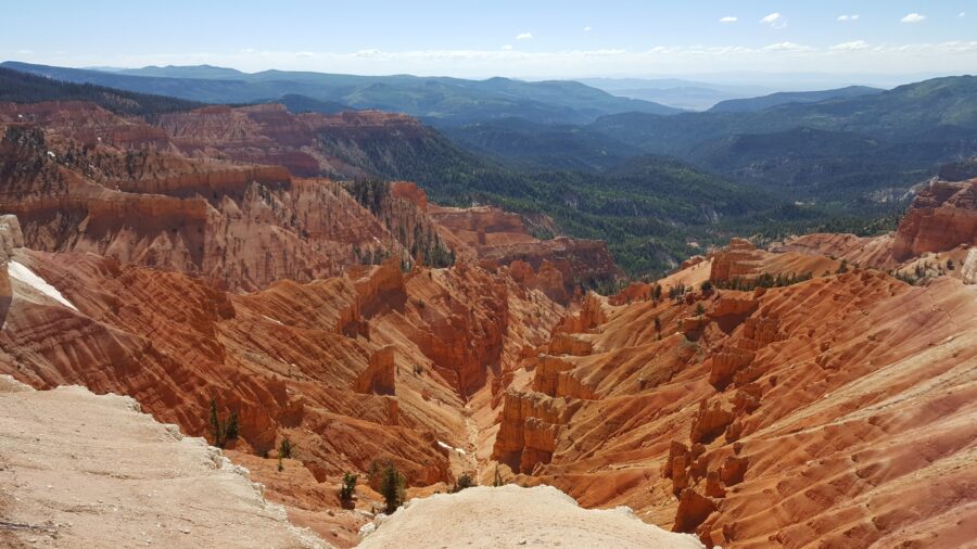 Scenic view of Cedar Breaks National Monument in Utah, showcasing colorful rock formations and expansive landscapes.