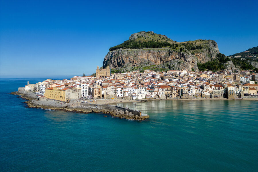 Panoramic view of Cefalù, a coastal town in Palermo, Italy, showcasing its historic architecture and scenic coastline
