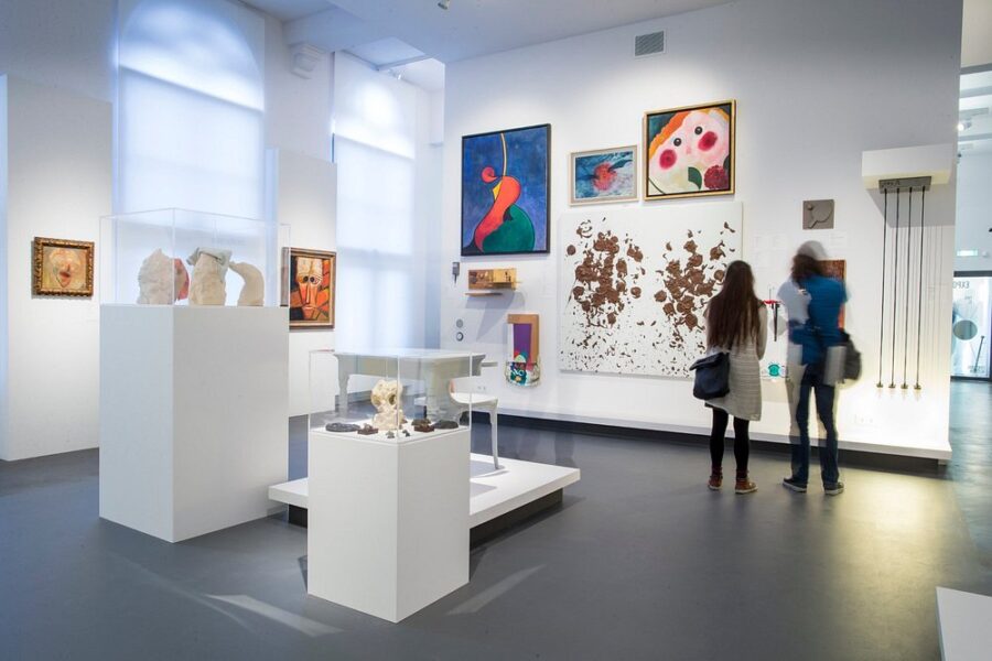 Interior view of an exhibit at the Centraal Museum Utrecht showcasing diverse art pieces and visitor engagement