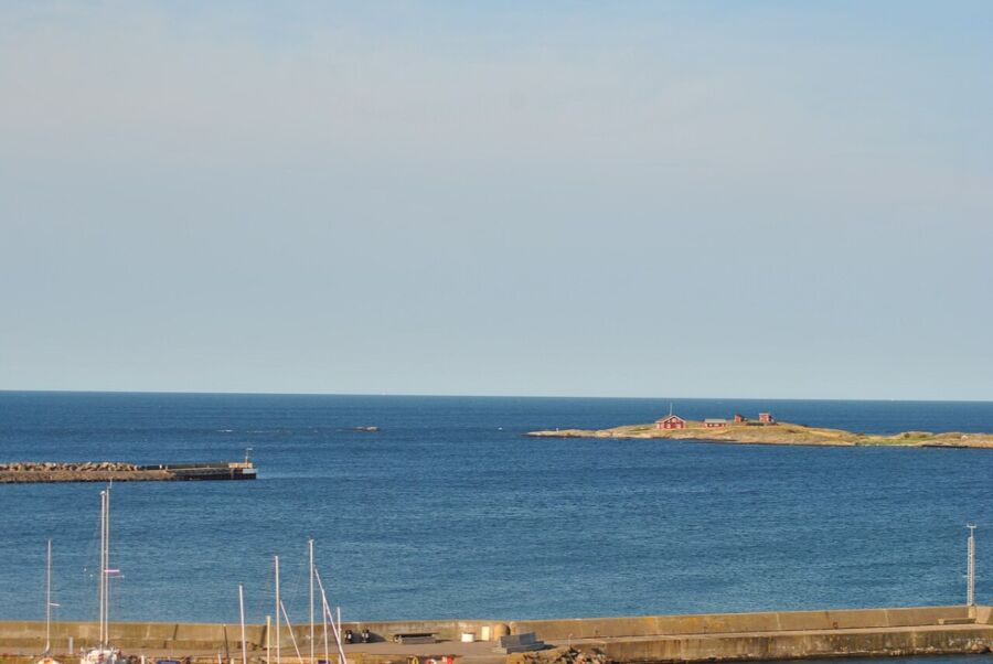 Panoramic view of the sea from an apartment balcony in Centrum Varberg, Sweden, highlighting the coastal scenery.
