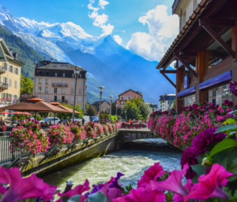 Panoramic view of the Arve River and Mont-Blanc massif from Chamonix, showcasing the stunning French alpine landscape.