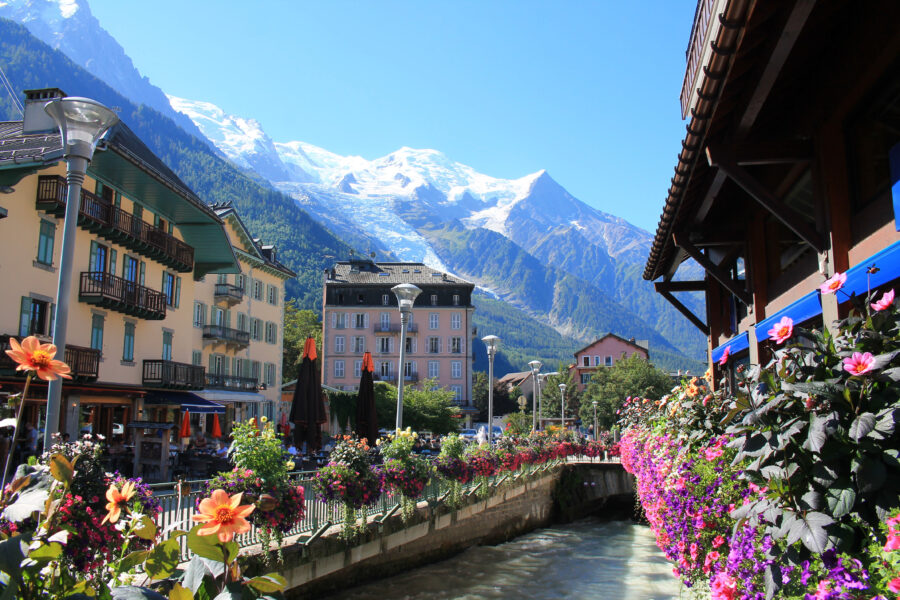 Scenic view of Chamonix Mont Blanc, a charming town in the French Alps, surrounded by majestic mountains and lush greenery.
