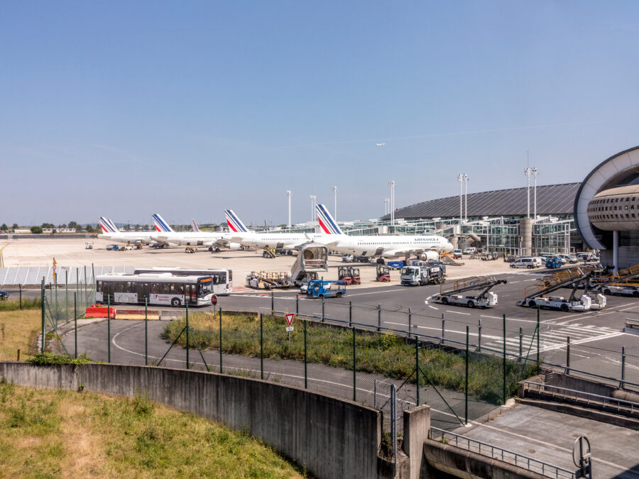 Air France plane stationed at the new Terminal of Charles de Gaulle Airport in Paris, showcasing modern architecture