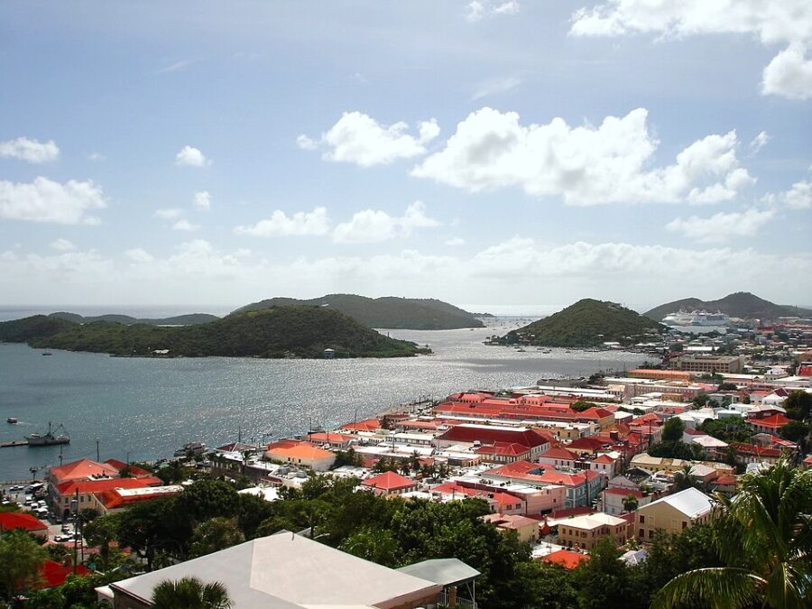 Panoramic view of St. John's town, showcasing its colorful buildings and lush surroundings in the Virgin Islands.