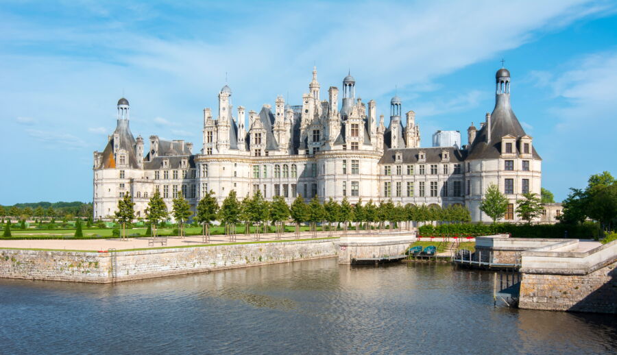 Chateau Chambord in the Loire Valley, France, showcasing its distinctive architecture against a clear blue sky.

