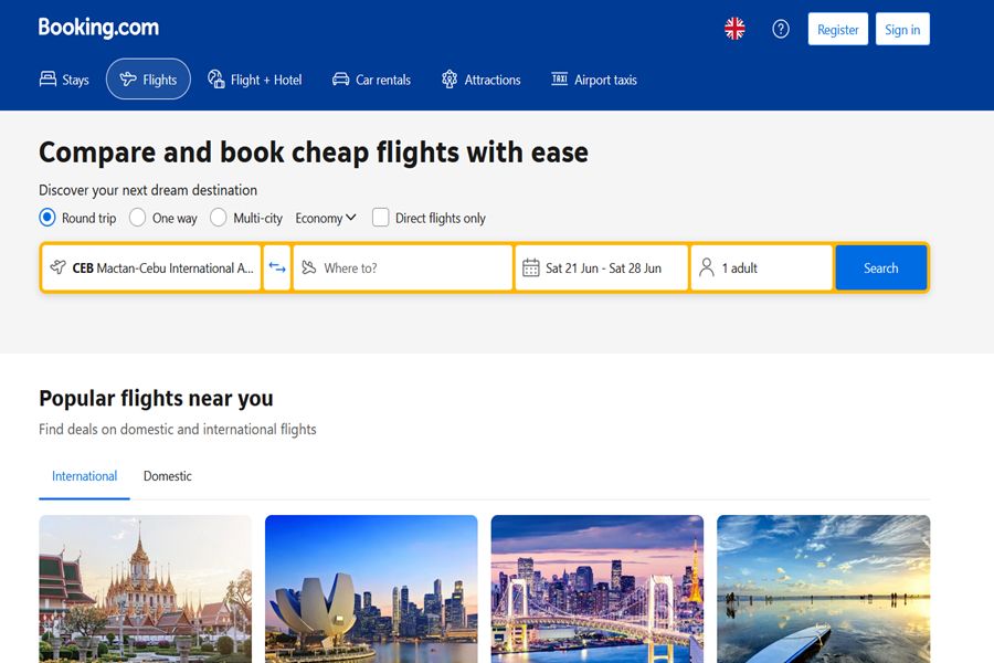 Booking.com interface for cheap flight bookings with search bar and travel options.