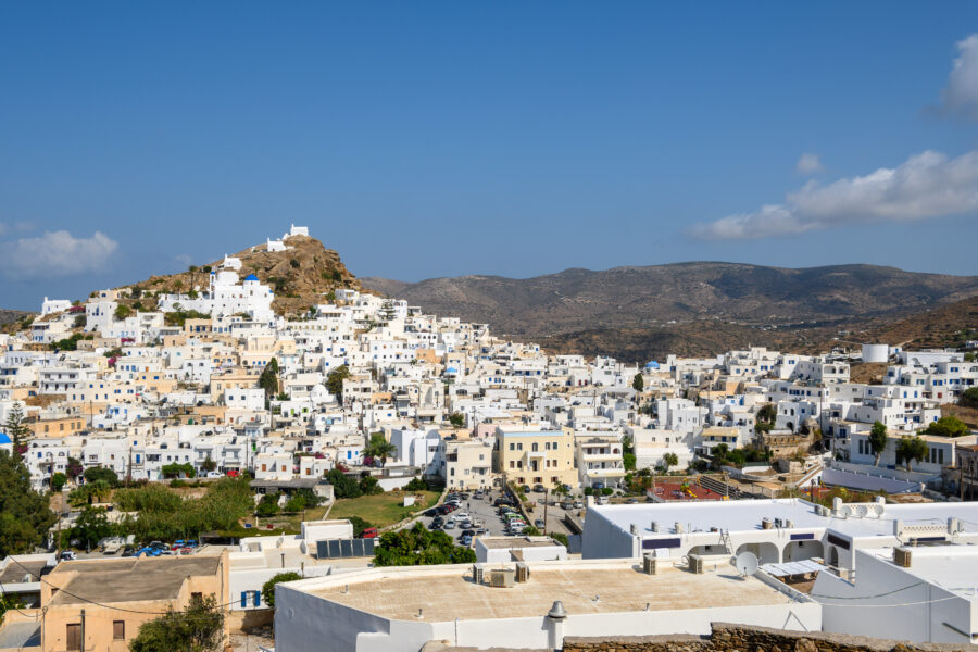 Chora of Ios in the Cyclades, Greece, glows softly in the evening sky after sunset