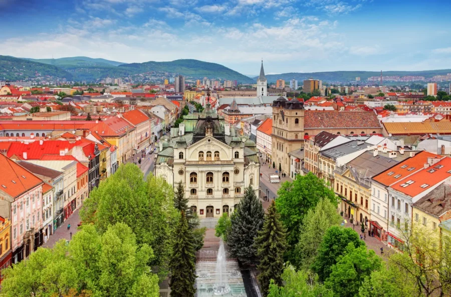 Košice aerial view of historic city center, boulevard, fountain, and red-tiled roofs.