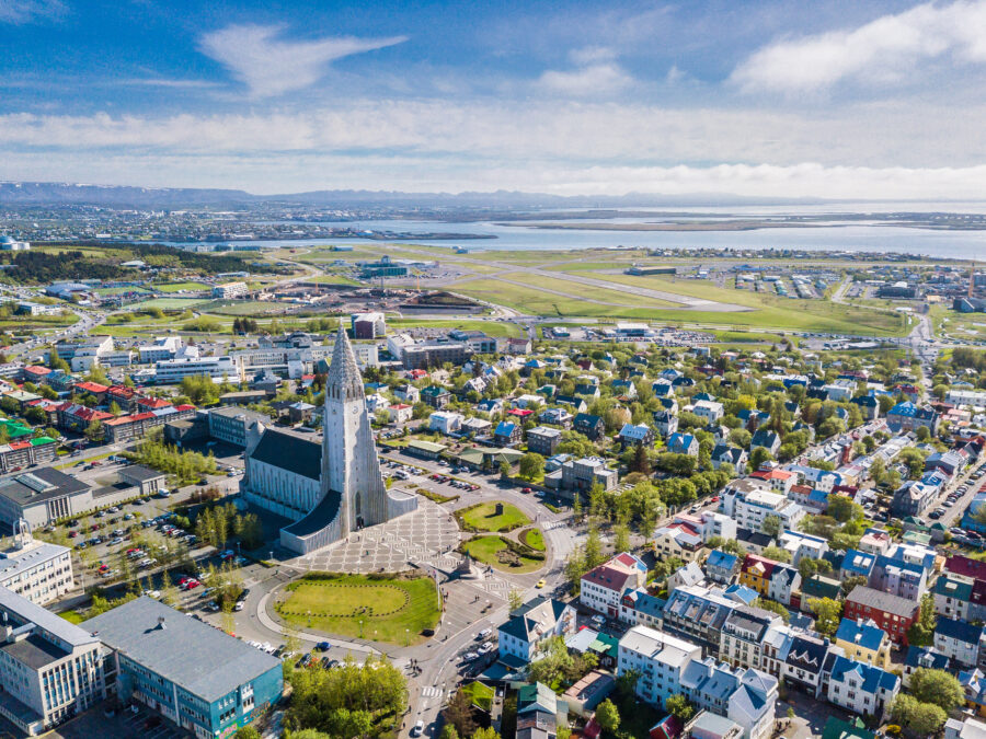 Aerial view of Reykjavik, Iceland, showcasing the cityscape with Hallgrimskirkja church prominently in the foreground