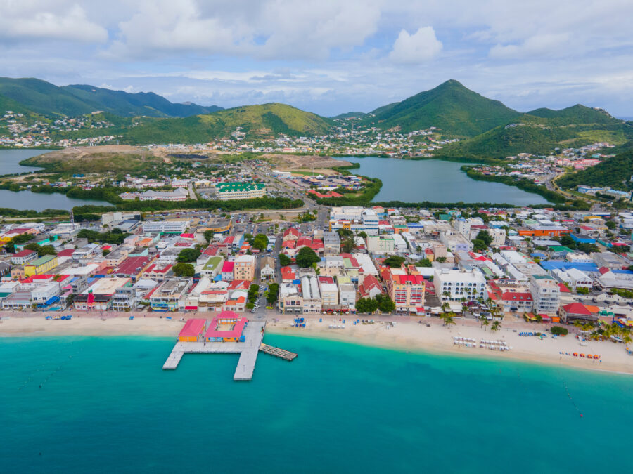 Aerial view of Philipsburg's historic city center, showcasing Front Street and the beach along Great Bay's Broadwalk.