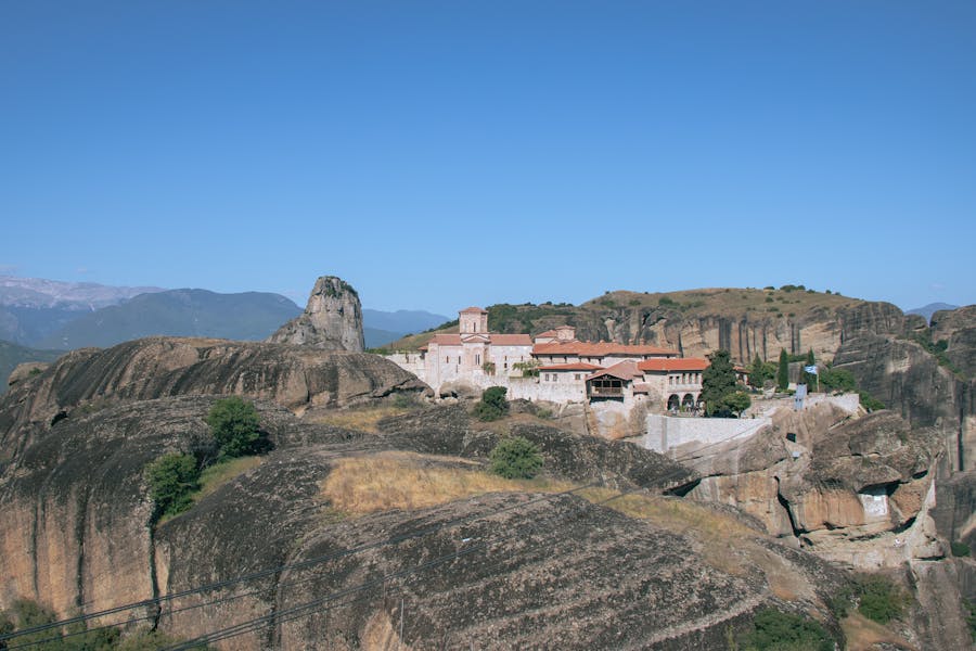 Meteora Holy Trinity Monastery perched on cliff pillars in Greece.