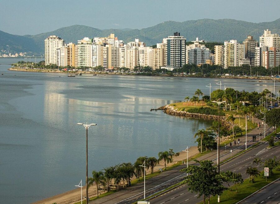 Waterfront skyline of Florianópolis Brazil with bayfront park, modern high-rise buildings and coastal road.