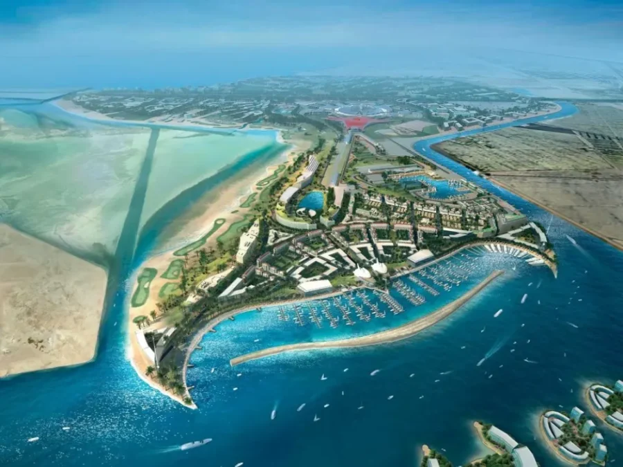 Aerial view of Yas Island marina resort, luxury waterfront development, golf course and desert coastline.
