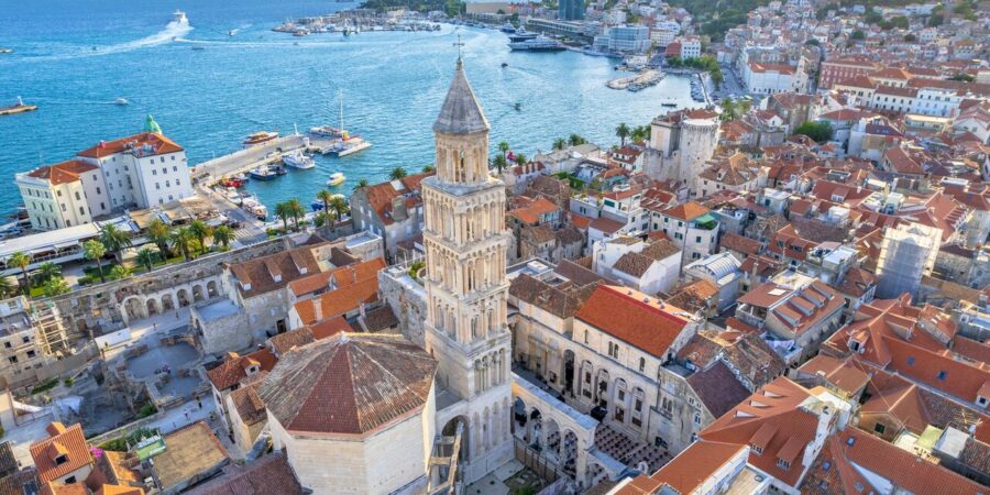 Aerial view of Split Croatia highlighting Diocletians Palace, harbor, and Adriatic Sea.