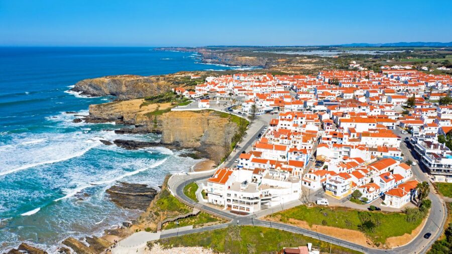 Aerial view of Zambujeira do Mar cliffs, coastal town on Portugals Atlantic shore.