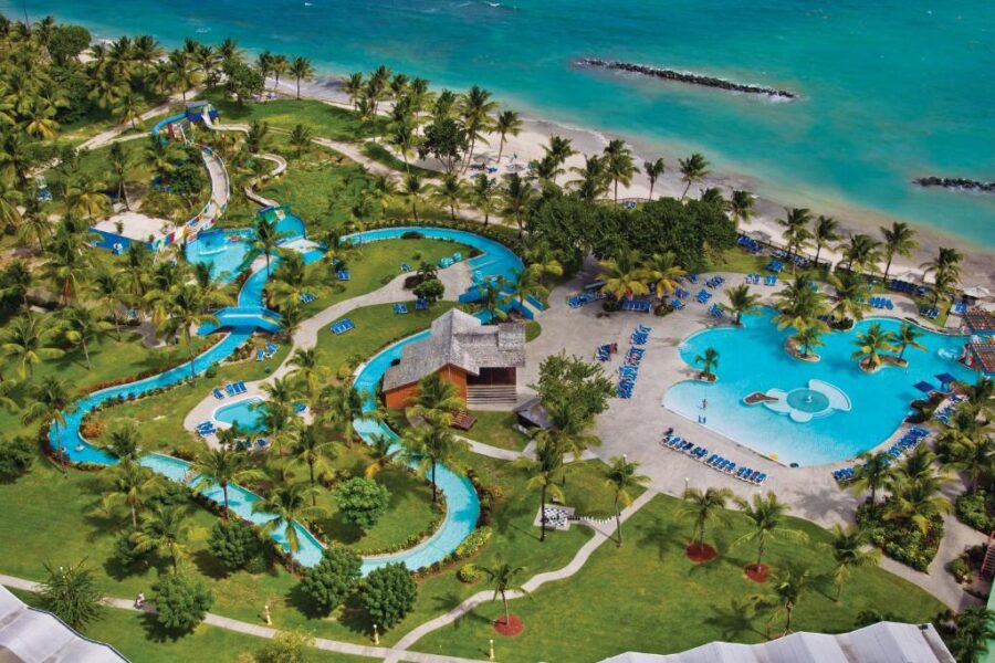 Aerial view of Coconut Bay Beach Resort's water park, showcasing slides and pools near the beach in Saint Lucia.