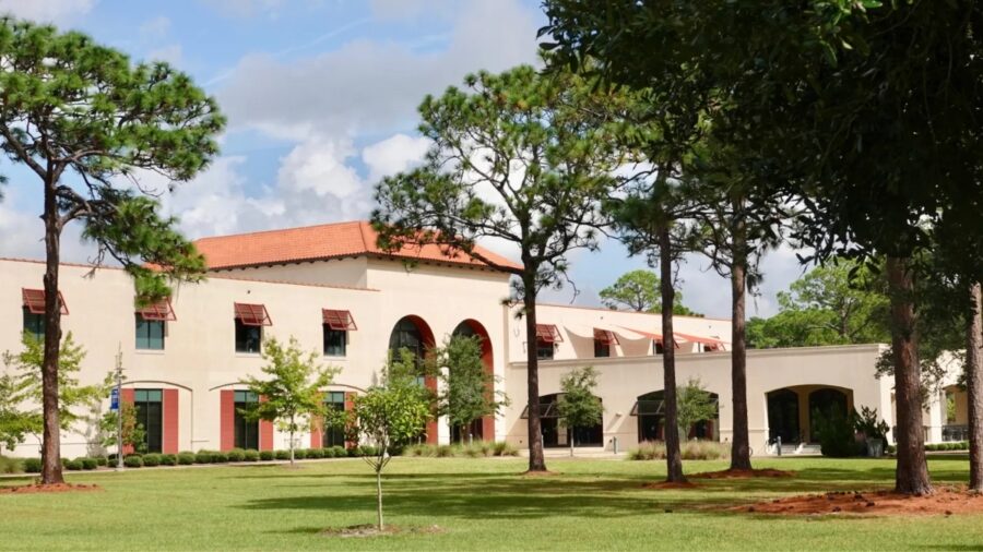 Exterior view of the College of Coastal Georgia Brunswick campus building, showcasing contemporary design and greenery.
