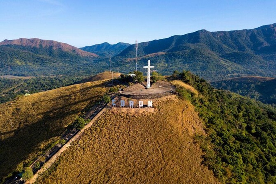 Mt. Tapyas Coron Palawan summit cross on ridge with stairs and panoramic mountain view.