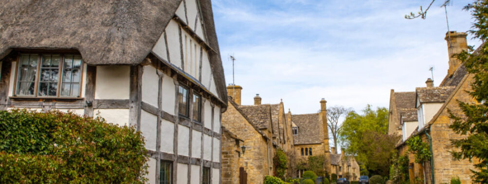 Scenic view of Stanton village in the Cotswolds, showcasing traditional stone cottages and lush green landscapes.
