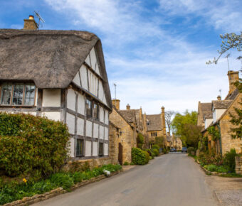 Scenic view of Stanton village in the Cotswolds, showcasing traditional stone cottages and lush green landscapes.