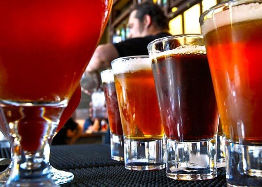 Bar scene with diverse craft beers, vibrant cocktails, and a lively social atmosphere.