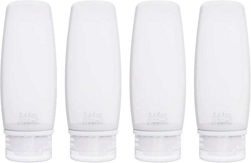 Four white Craftend silicone travel bottles of body wash arranged on a clean white background.