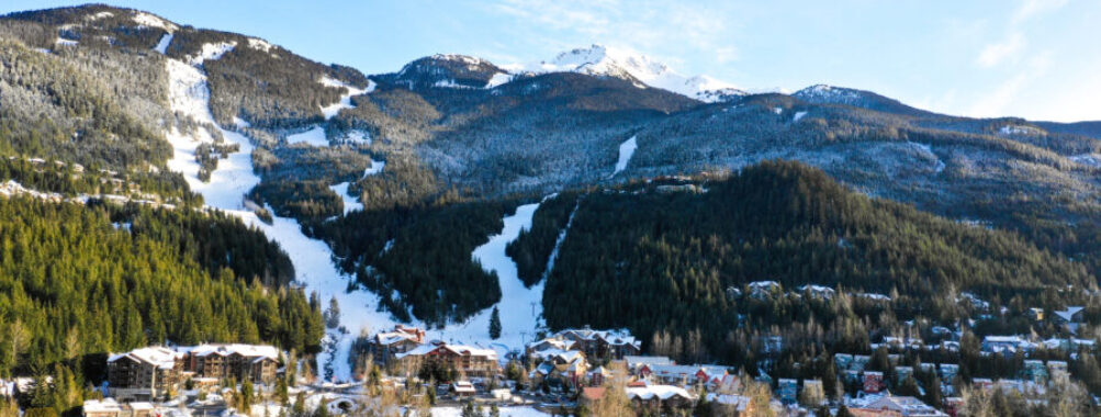 Scenic view of Creekside Village in Whistler Blackcomb, showcasing charming buildings and surrounding mountain landscape.