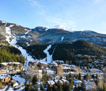 Scenic view of Creekside Village in Whistler Blackcomb, showcasing charming buildings and surrounding mountain landscape.