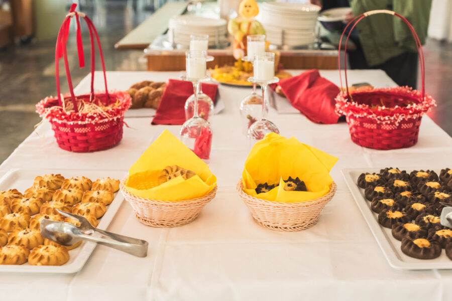 Cretan sweet cheese pastries (Kalitsounia) arranged on a hotel restaurant table, celebrating Easter with guests.
