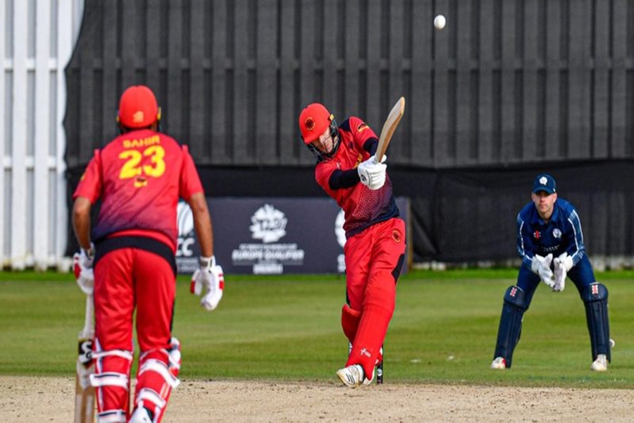 Intense cricket action: batsman in red swings against navy blue wicketkeeper in ECS Croatia T10.