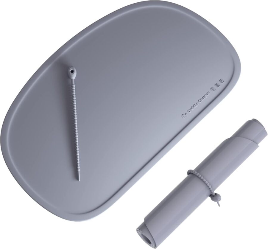 Gray tray with a pen and pencil, showcasing the Cuddle Campus Silicone Travel Placemat theme.
