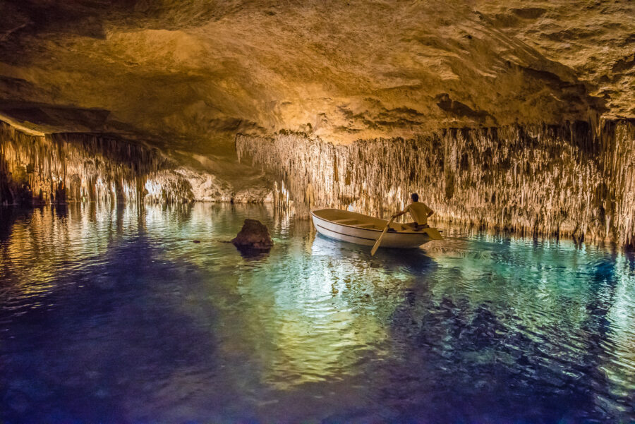 Interior of the Cuevas del Drach, highlighting the unique geological features and serene underground lakes in Majorca, Spain.