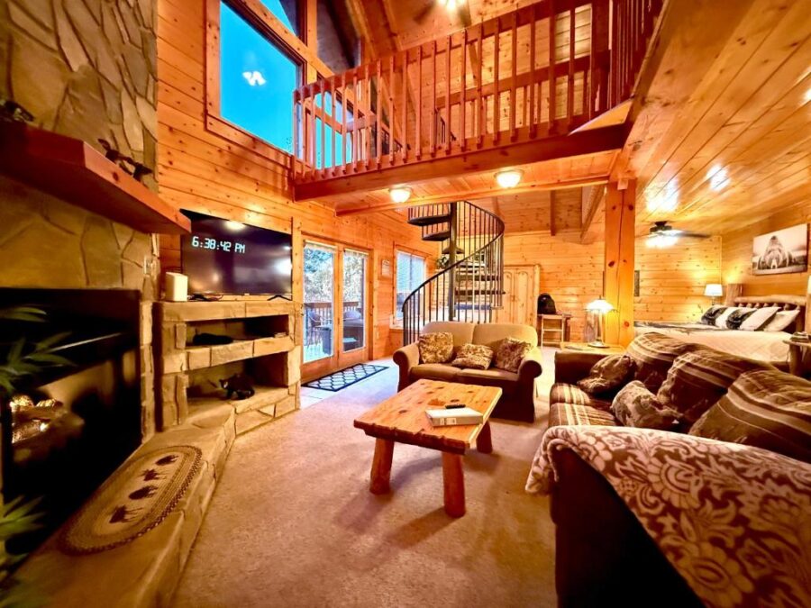 Daa Bears Lodge, a rustic cabin surrounded by trees, featuring a welcoming porch and a cozy atmosphere.