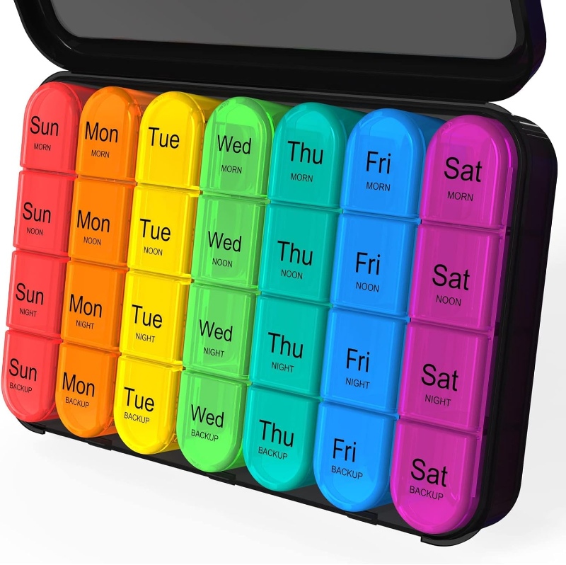 Vibrant box labeled 'Daviky Travel Pill Organizer' with a calendar graphic displayed prominently.