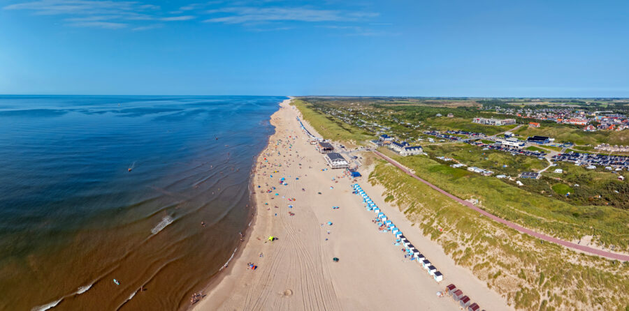 anoramic aerial image of De Koog village on Texel Island, highlighting its scenic beauty and coastal features.