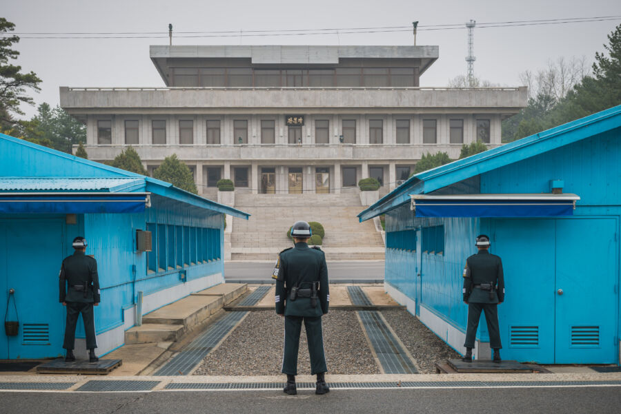 The Demilitarized Zone (DMZ) separating North and South Korea, marked by barbed wire and watchtowers