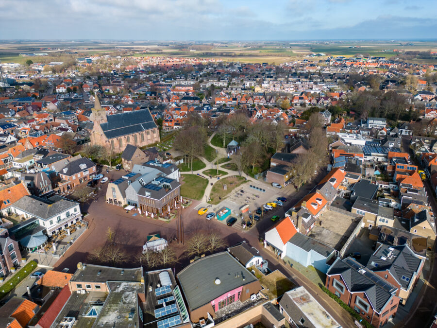 City center of Den Burg on Texel Island, showcasing charming architecture and vibrant landscapes typical of the Dutch countryside.