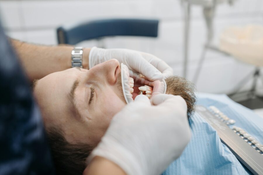 Patient relaxed during dental procedure, showcasing a clean, professional dental office environment.