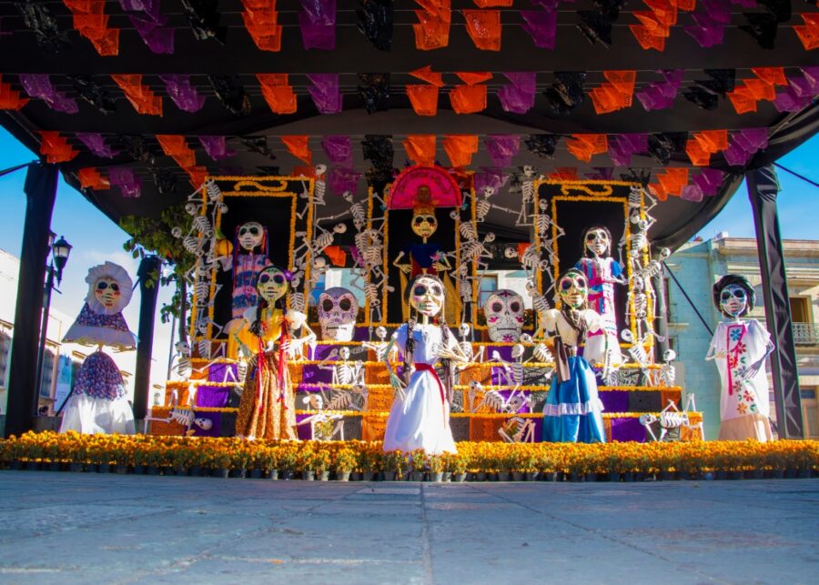 Traditional Día de los Muertos altar in Oaxaca, featuring vibrant marigolds, sugar skulls, and offerings for the departed