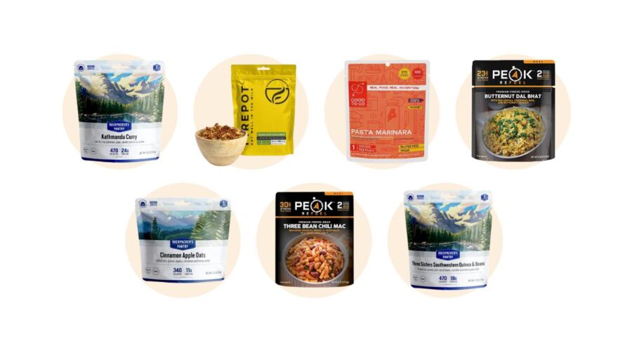 Variety of freeze-dried vegan backpacking meals, showcasing chips, crackers, and assorted snacks for convenient outdoor dining.