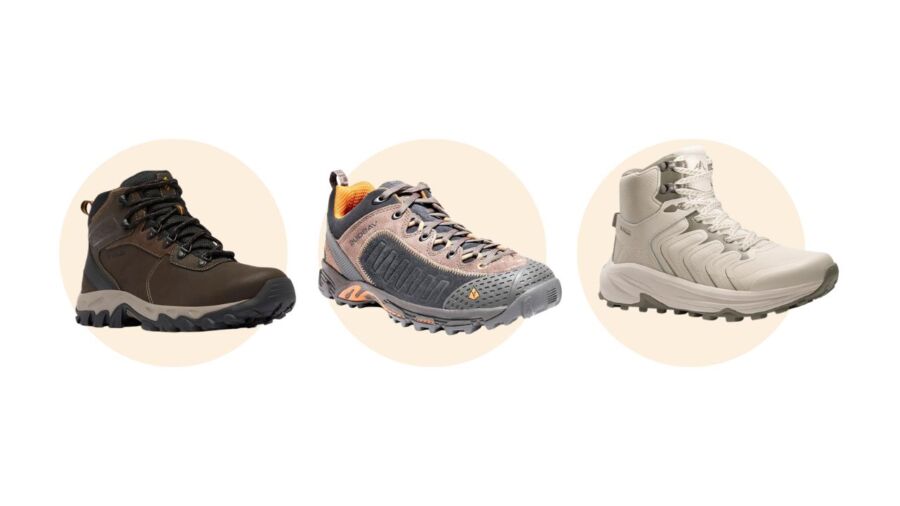 Three hiking shoes are displayed against a light beige background: a dark brown boot, a gray and orange shoe, and a beige high-top sneaker.