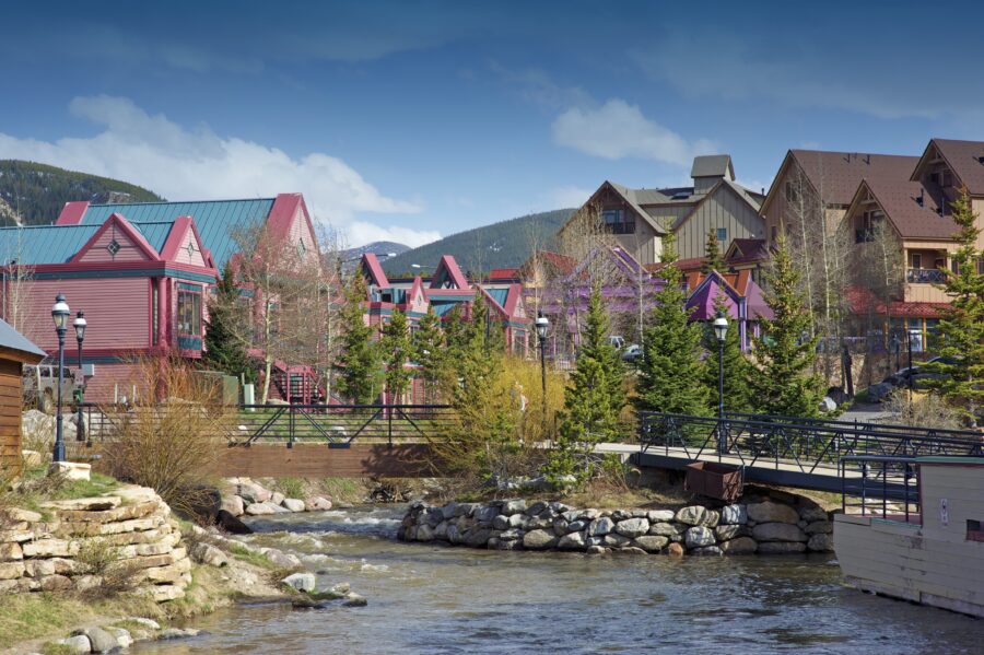 Downtown Breckenridge, Colorado, featuring charming shops, restaurants, and snow-capped mountains in the background
