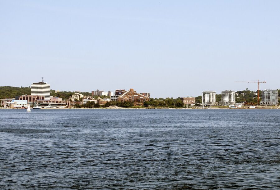 Downtown Dartmouth Waterfront in Halifax, Nova Scotia, showcasing a serene body of water with city views in the background.