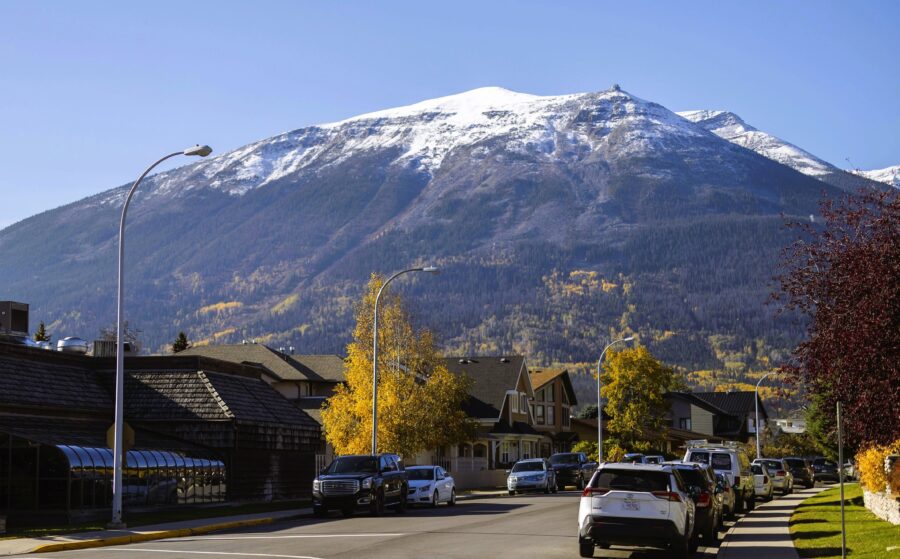 Scenic view of downtown Jasper, Alberta, Canada, framed by a towering mountain in the background.