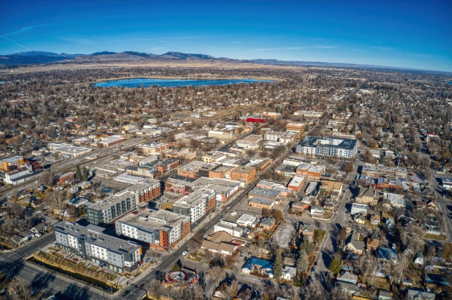 Aerial view of downtown Loveland, Colorado, showcasing city buildings, streets, and surrounding greenery