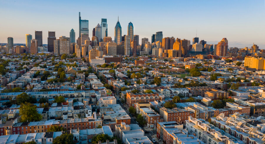 Sunset over South Philadelphia, with the city skyline in the background.