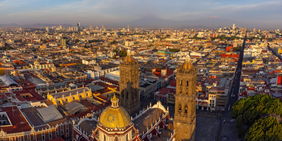Aerial view of Puebla downtown at sunrise, showcasing colorful buildings and historic architecture in Mexico