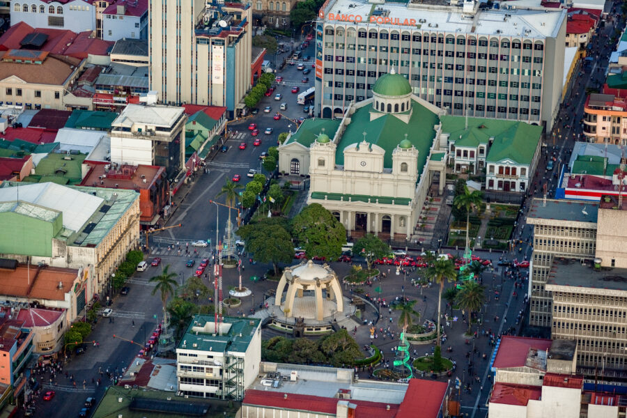 Downtown San José, Costa Rica, featuring Parque Central and the Metropolitan Cathedral, surrounded by lively urban scenery