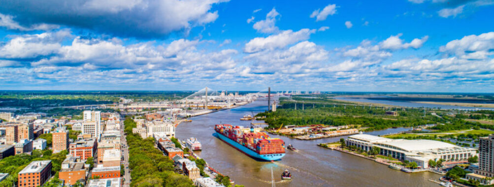 Downtown Savannah, Georgia, captured from above, highlighting its iconic buildings and scenic riverfront.