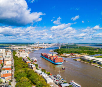 Downtown Savannah, Georgia, captured from above, highlighting its iconic buildings and scenic riverfront.